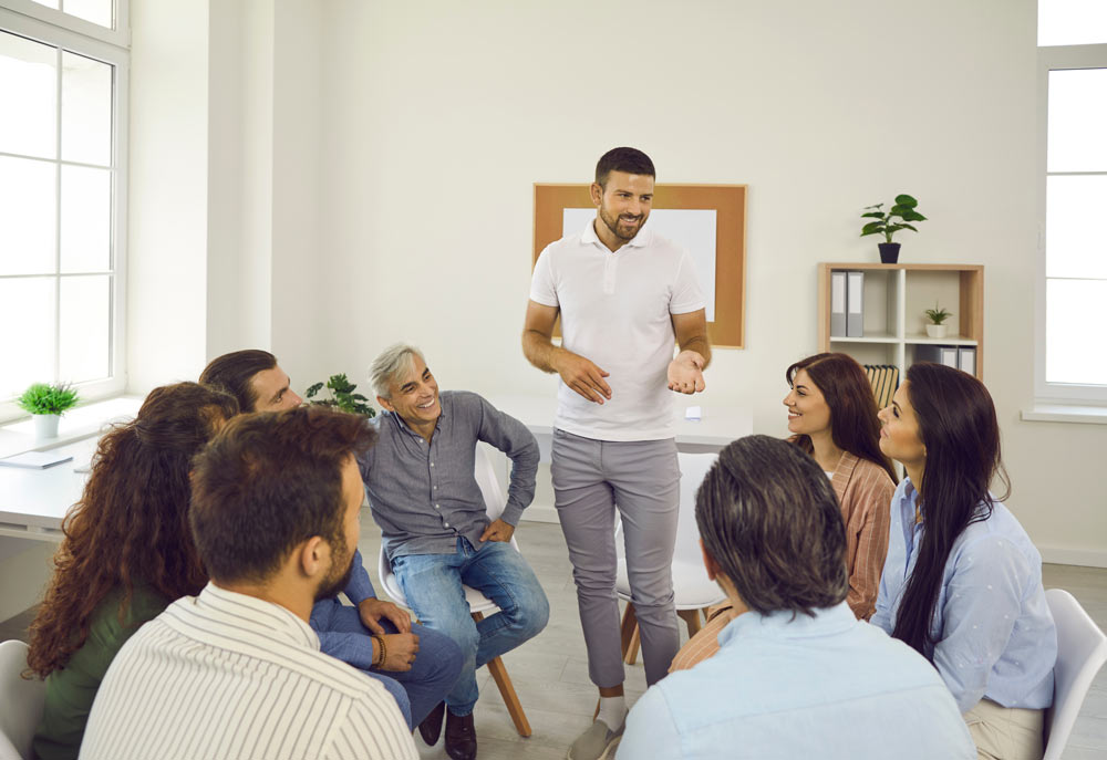 A group of individuals in a training seminar for professional retraining